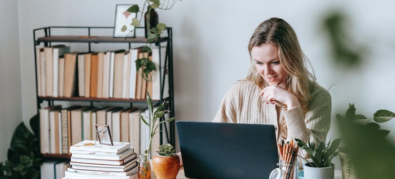 A person engaged in crafting empathetic ad campaigns for rehab centers on their laptop