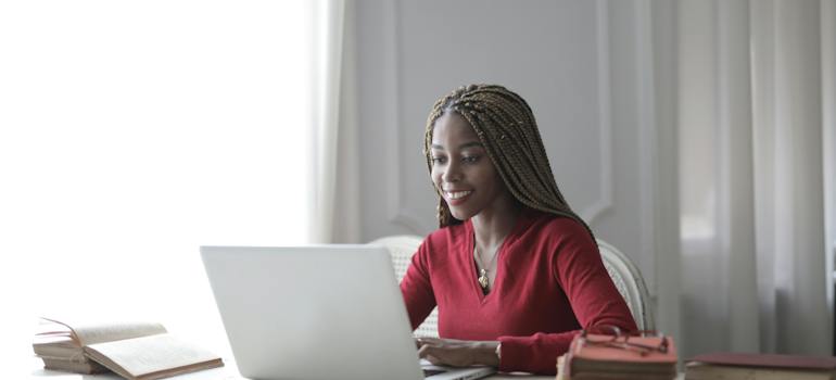 A happy person using the laptop
