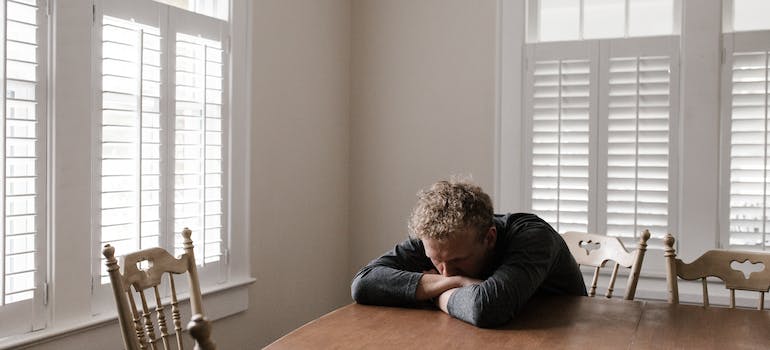 A depressed person sitting alone