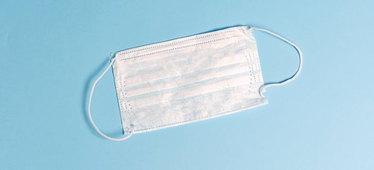 A surgical mask on the blue background