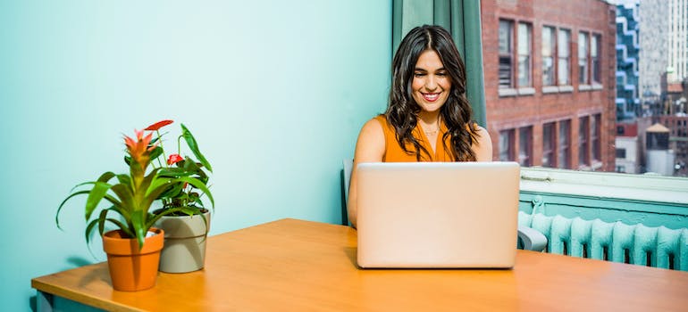 A person searching for rehab centers on a laptop