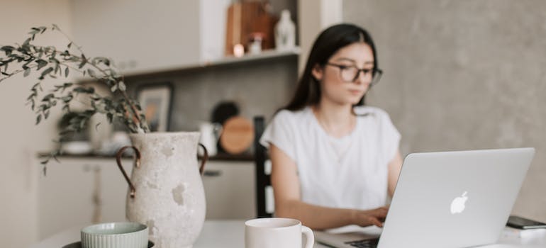 A person using a laptop to write feedback for a healthcare institution, which is an instance of how social media is changing healthcare