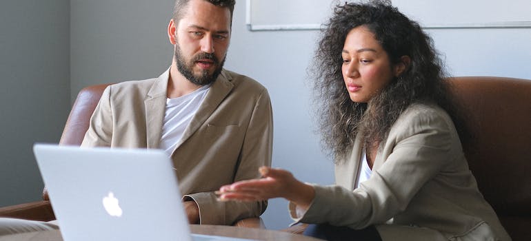 A person showing how digital marketing helps your transportation company to their colleague