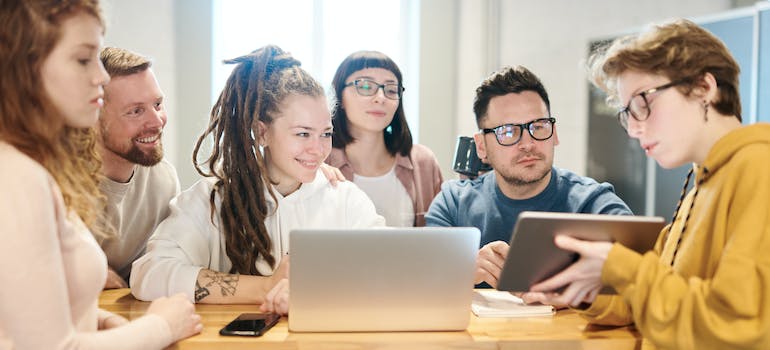 Colleagues learning about how digital company helps your transportation company