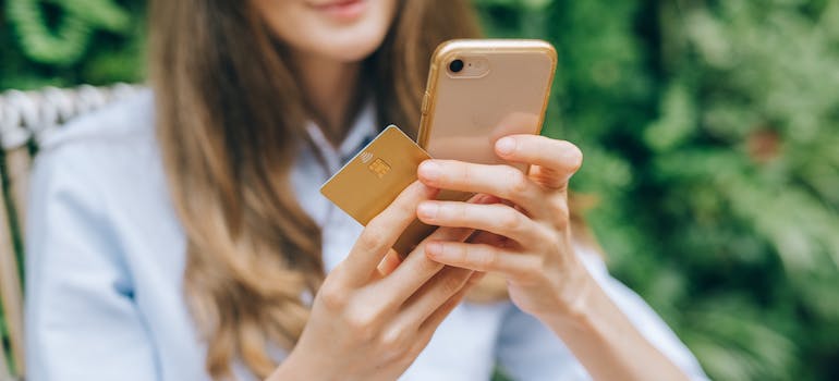 A person shopping online using their mobile phone