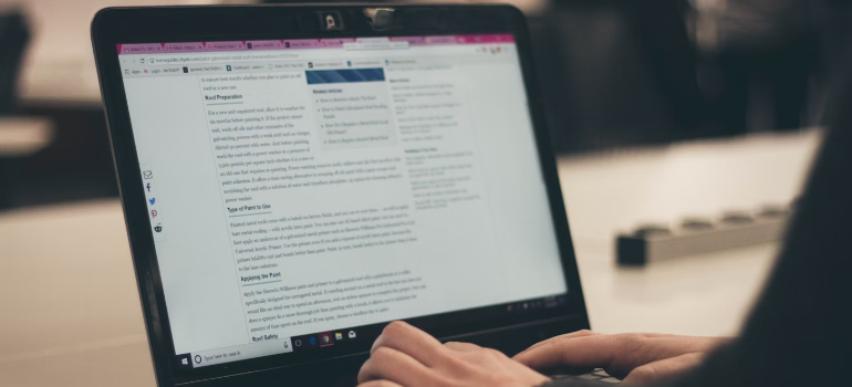 A person typing a blog