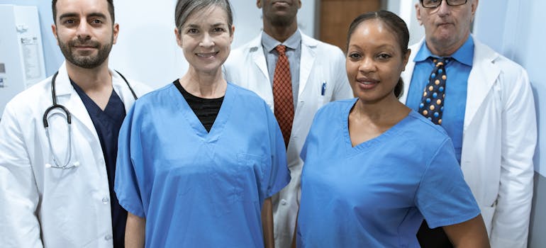 a group of doctors and nurses standing