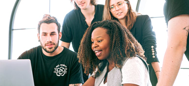 People looking at the laptop