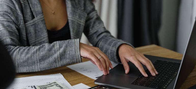 a person typing something on a laptop