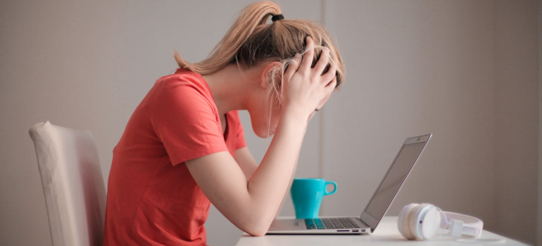 a woman holding her head