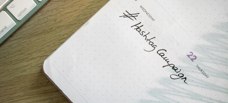 A planner with the note "#Hashtag Campaign" written on it, emphasizing the role of hashtags in successful mental health awareness campaigns.