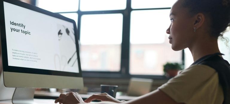 Woman blogging for addiction treatment and recovery on her computer