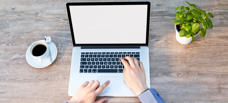 a man on the laptop Designing an Addiction Treatment Center Homepage