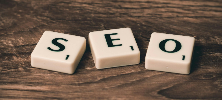 Scrabble tiles spelling 'SEO' on a wooden surface, emphasizing the importance of optimizing a website for your solar business.