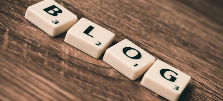 blog written on a wooden surface 