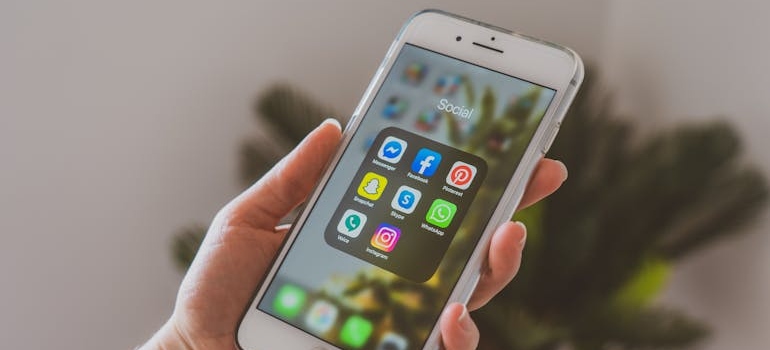 A smartphone with social media apps, which are great platforms for promoting unique cosmetic surgery services