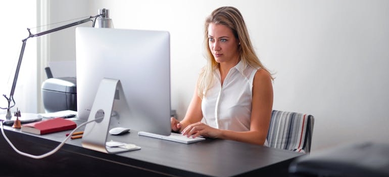 A person using a computer to analyze how effective their search engine optimization for counselors is