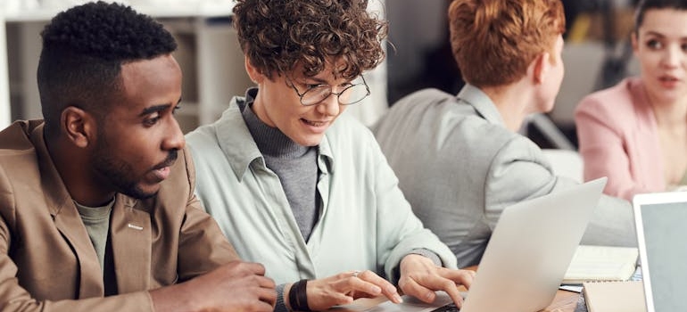 Colleagues talking about the benefits of ADA-compliant websites for addiction treatment facilities