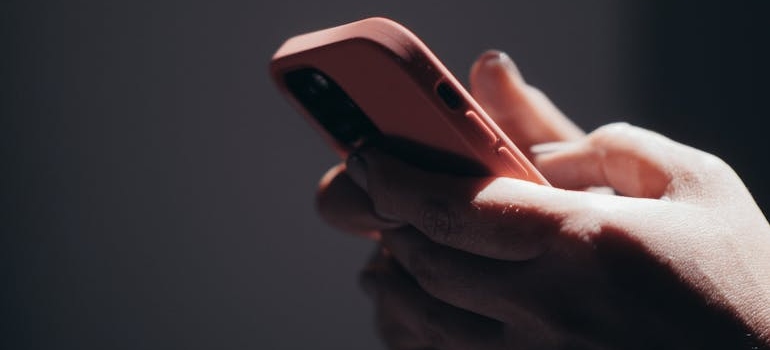 A person using their phone to search for practices for engaging patients during the holiday season