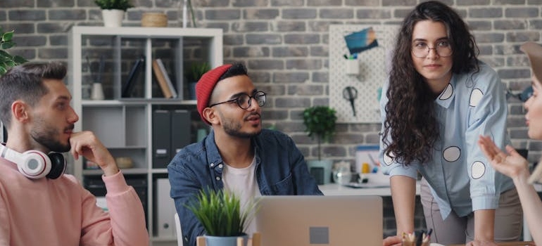 A group of coworkers discussing how AI is transforming digital marketing in Dubai