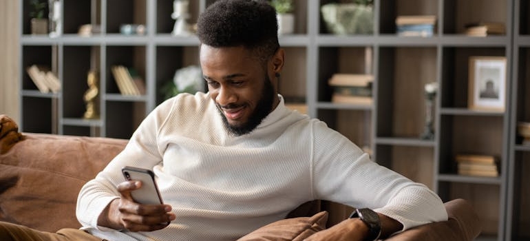 A person using their smartphone to connect with an inpatient mental health facility