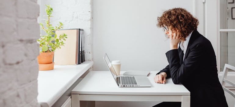 A business person using a laptio and learning how to set up and verify your Google Business Profile in Dubai