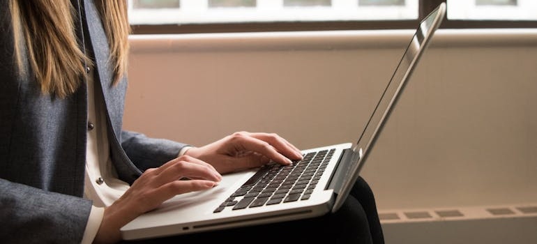 A person using a laptop to read about the importance of link building for SEO in Dubai