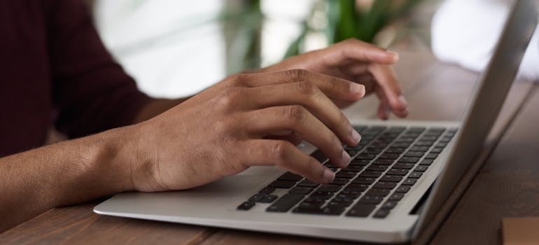 A person using a laptop to search online
