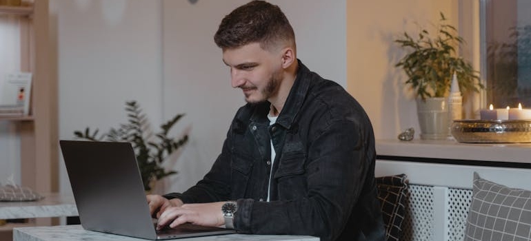 A person using their laptop to look for addiction centers