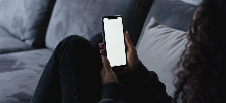 A person using their smartphone to search online