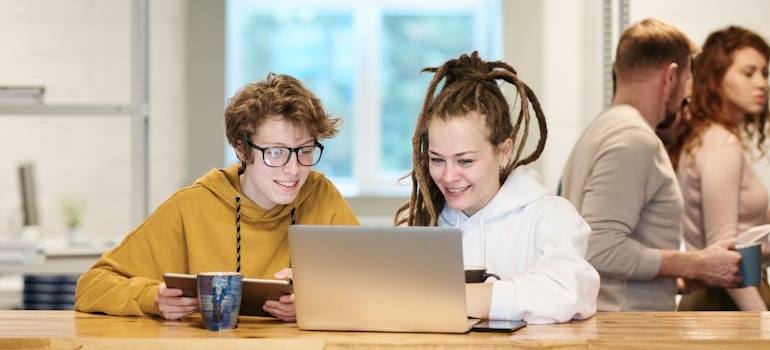 Two colleagues doing online research on why Arabic content matters for SEO in Dubai