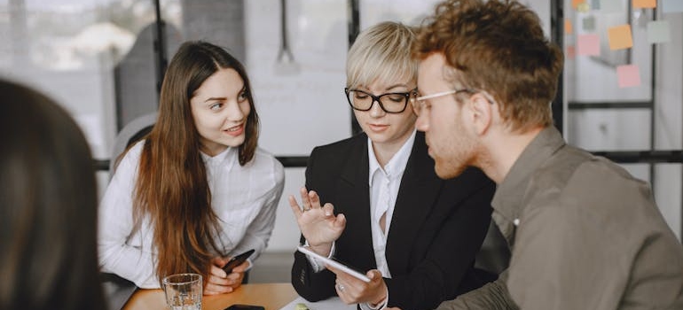 A digital marketing team sharing ideas on how to write the perfect Instagram bio