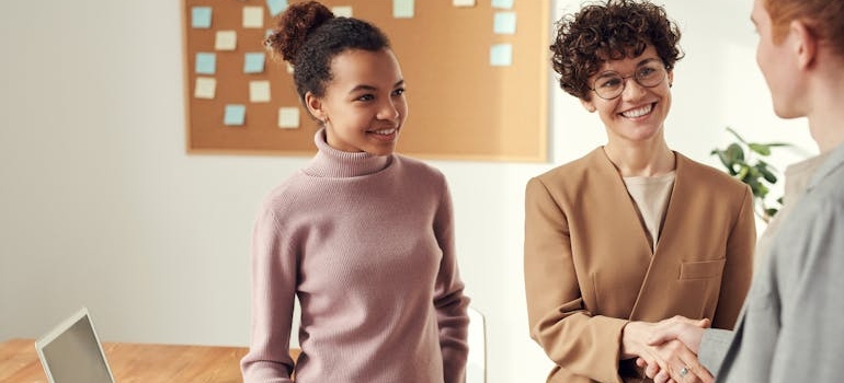 Digital marketing experts shaking hands after a meeting