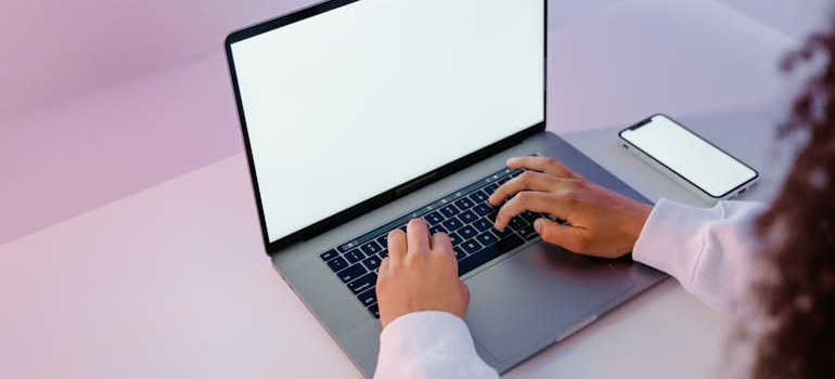 A person using a laptop to search online