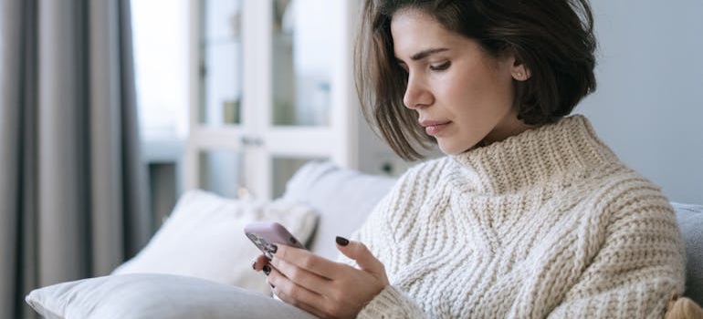 A person using a smartphone to searching for mental health centers