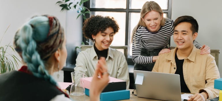 A digital marketing team talking about the impact of AI on Canadian digital marketing strategies