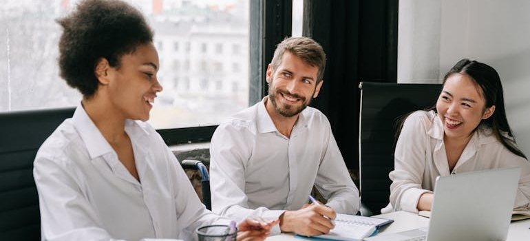 A team of marketing experts discussing ADA compliant web design for med spas