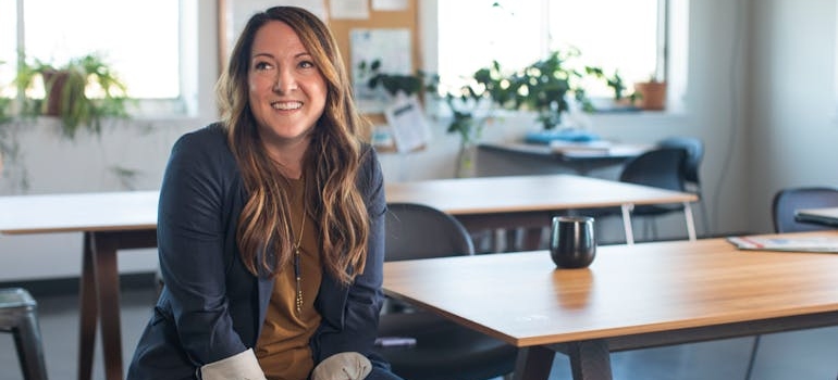 A person at their workplace feeling optimistic after their treatment program