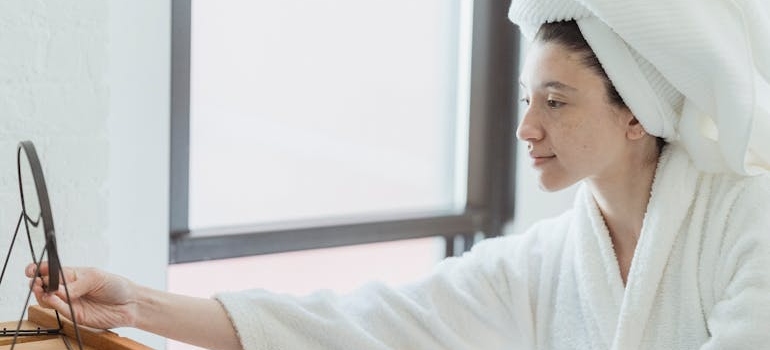 A person looking at themselves in the mirror