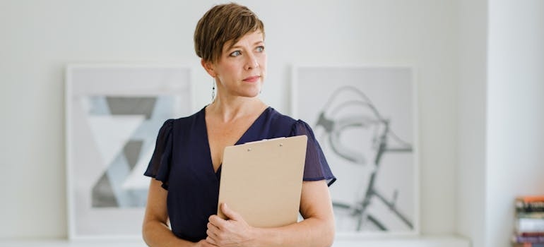 A therapist holding their notes