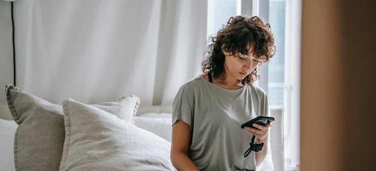 A person using a smartphone to explore services of a company they found on one of the best Canadian business directories for local link building