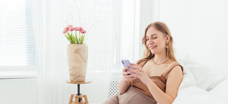 A person using a smartphone to read an email from a med spa
