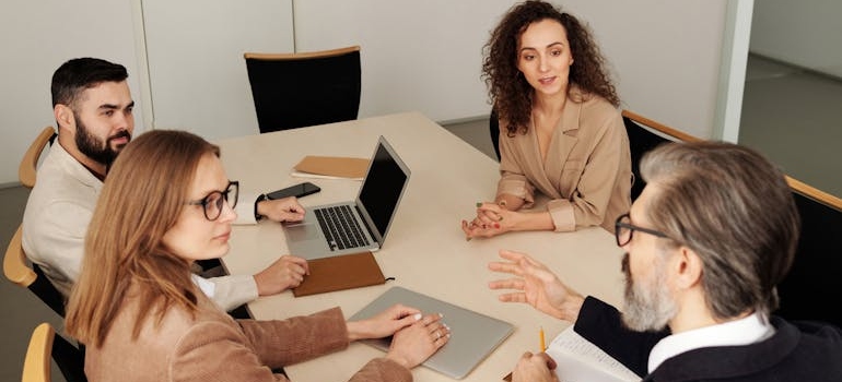 Colleagues sharing their ideas on how to increase Google Business Profile traffic to your addiction treatment center