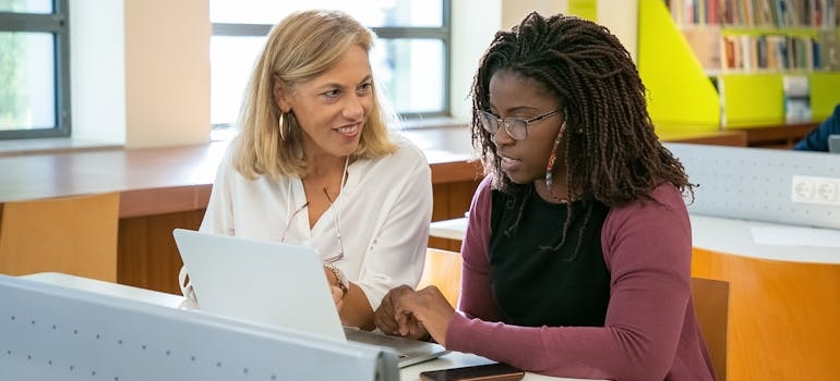 A teacher talking to a student about mental health resources