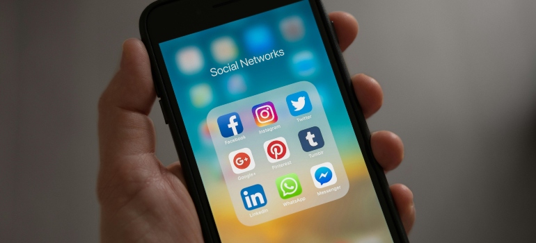 A close-up of a phone screen with social media apps.