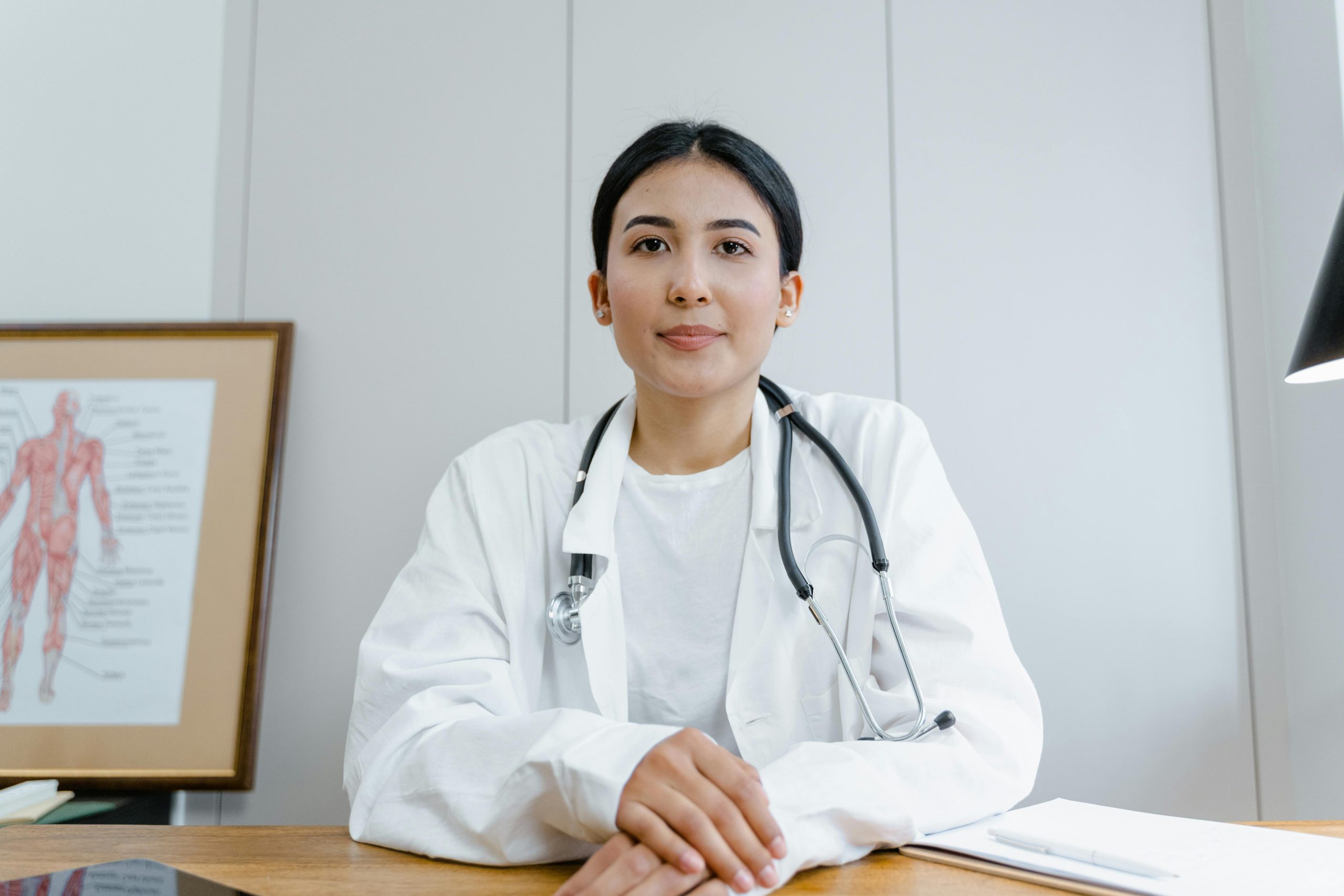 A doctor posing for the camera, explaining how Aesthetic clinics can appear in AI overviews.