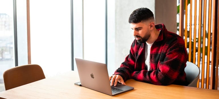 A person using a laptop to look for addiction centers