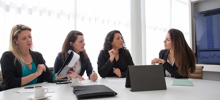 A team of digital marketing experts discussing YMYL and E-E-A-T in medical aesthetics