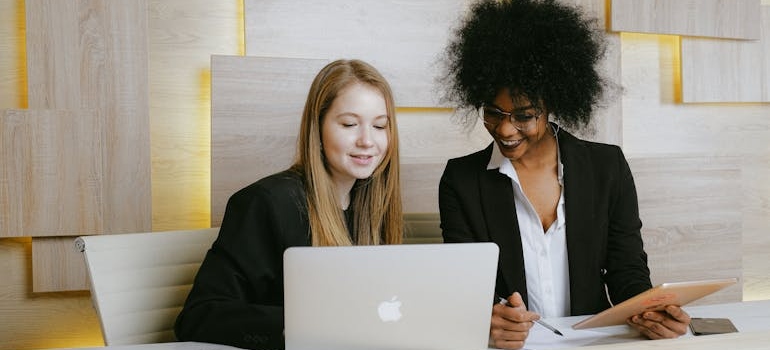 Two colleagues working on HIPAA-compliant email marketing for therapists