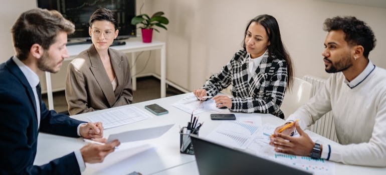 A digital marketing team having a meeting about FTC rules on rehab advertising